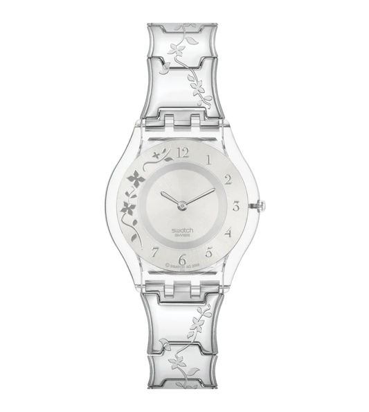 CLIMBER FLOWERY Un charmant motif floral en acier sur acier. Une fleur gravée en acier grimpe à travers les élégants maillons arqués en acier du bracelet. Cette Skin raffinée et délicatement dessinée a un boîtier en plastique transparent et un cadran argenté brossé soleil sur lequel un motif en applique de fleur argentée complète les chiffres arabes argentés et polis aux heures 1 à 7 et 12. Délicates aiguilles des heures et des minutes aux extrémités rondes.   SS08K100G